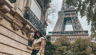 girl in front of eiffel tower paris
